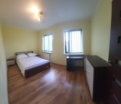 Postel nebo postele na pokoji v ubytování Apartament Lea