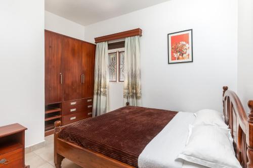 Postel nebo postele na pokoji v ubytování Corinya Serviced Apartments