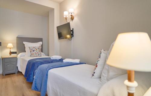 Ένα ή περισσότερα κρεβάτια σε δωμάτιο στο Hotel Anglada