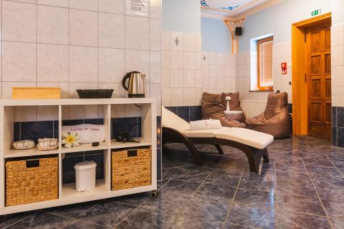 a living room with a table and a couch at Pension Török in Lesce