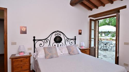 Postel nebo postele na pokoji v ubytování Aia di Ama