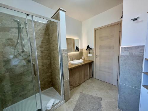 a bathroom with a shower and a sink at La Cinisara in Carini