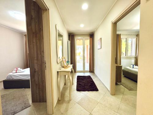 a hallway with a room with a bed and a table at La Cinisara in Carini