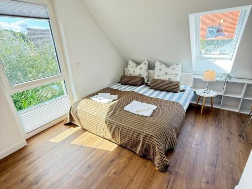 Ένα ή περισσότερα κρεβάτια σε δωμάτιο στο Ferienhaus DeRuhHus