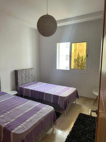 Postel nebo postele na pokoji v ubytování Apartment S2 AFH2 Nabeul