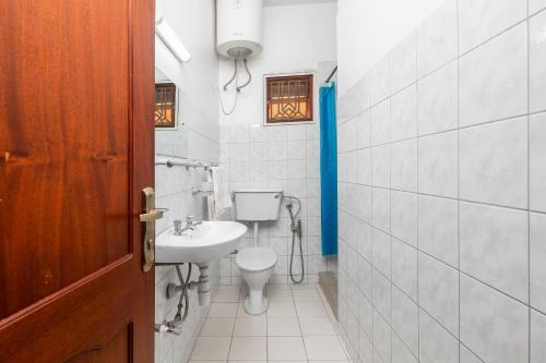 Koupelna v ubytování Corinya Serviced Apartments