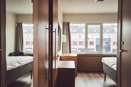 Postel nebo postele na pokoji v ubytování Quality Hotel Maritim