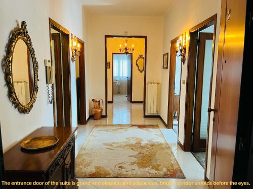 a hallway of a home with a mirror and a rug at Luxury Relax Apartment near Venice Station in Venice