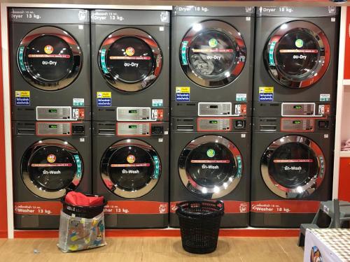 a bunch of washing machines in a store at Den Nest Hostel KRABI in Krabi