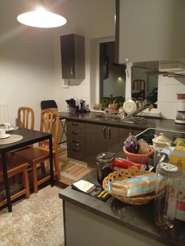 a kitchen with a table and a counter top at B&Bestradas in Vaggeryd