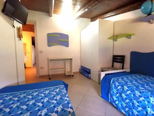 Ένα ή περισσότερα κρεβάτια σε δωμάτιο στο Gelsomina Maison-SCARIO