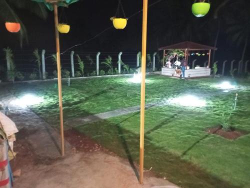 a park at night with a gazebo at Friendly homestay in Mysore
