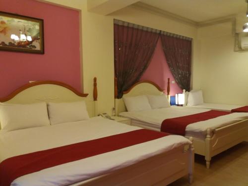 Ένα ή περισσότερα κρεβάτια σε δωμάτιο στο Money B&B