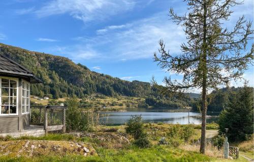 a house with a view of a lake at Stunning Home In Korssund With Wifi in Våge