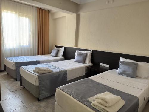 Postel nebo postele na pokoji v ubytování Reis Thermal Otel