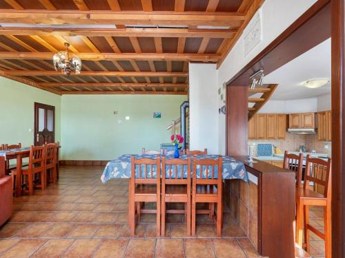 a kitchen and dining room with a table and chairs at Holiday Home Loukov u Semil by Interhome in Loukov