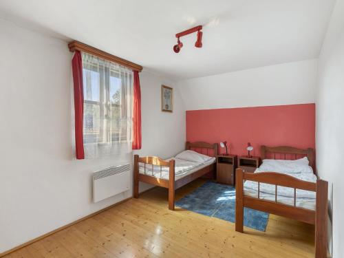 a room with two beds and a window at Holiday Home Loukov u Semil by Interhome in Loukov