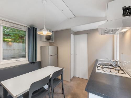 a kitchen with a white counter and a refrigerator at Holiday Home Florida by Interhome in Prague
