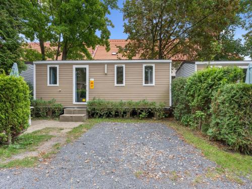 a house with a gravel driveway in front of it at Holiday Home Florida by Interhome in Prague