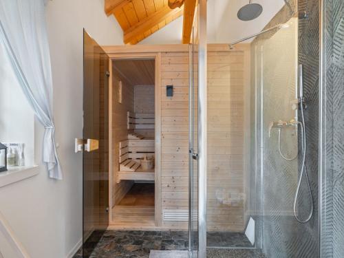 a shower in a bathroom with a glass shower stall at Holiday Home Roubenka Maleč by Interhome in Strašín
