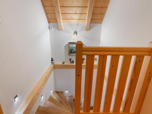 a staircase in a house with white walls and wooden ceilings at Holiday Home Roubenka Maleč by Interhome in Strašín