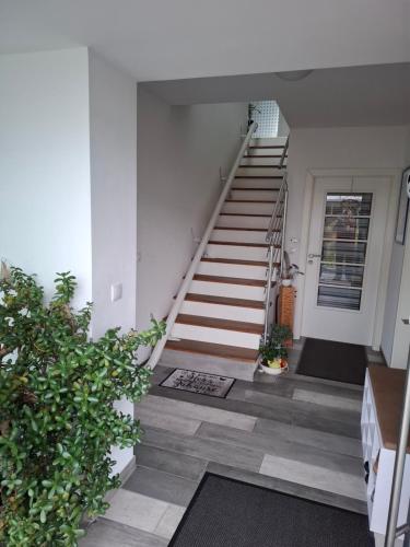 a staircase in a house with a stair case at Ferienwohnung Sonnenschein in Neuwied