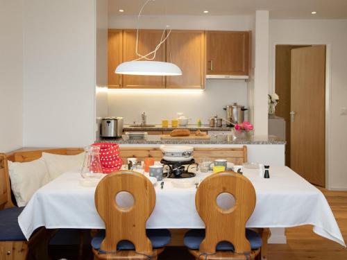 a kitchen with a table and two chairs at Apartment La Siala Apt-19 by Interhome in Falera