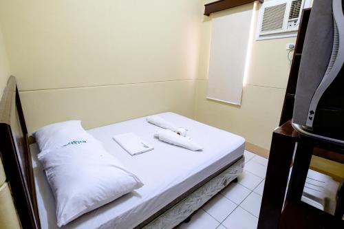 Ένα ή περισσότερα κρεβάτια σε δωμάτιο στο GV Hotel - Pagadian