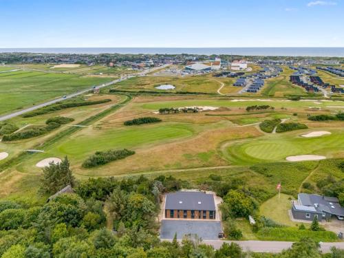 an aerial view of the golf course at a resort at Holiday Home Øthger - 1-3km from the sea by Interhome in Ringkøbing