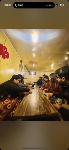a group of people riding a bowling alley at Iris cafe and cozy stay in Tosh