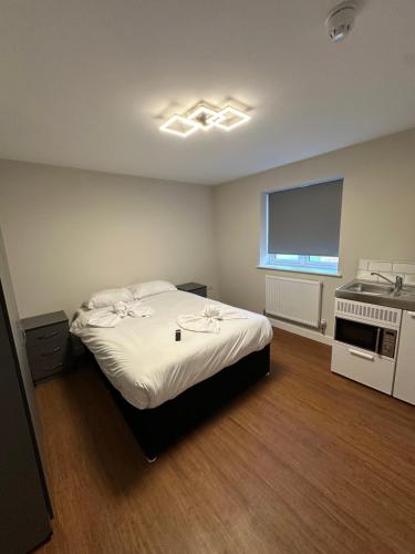 Ένα ή περισσότερα κρεβάτια σε δωμάτιο στο Wendover Annexe