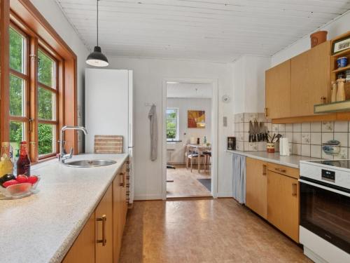 a kitchen with a sink and a counter top at Holiday Home Andri - 1-5km from the sea by Interhome in Rønne