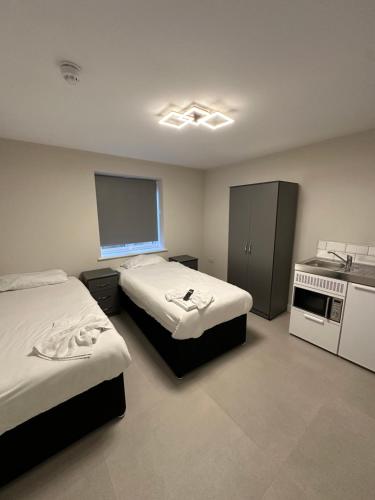 Ένα ή περισσότερα κρεβάτια σε δωμάτιο στο Wendover Annexe