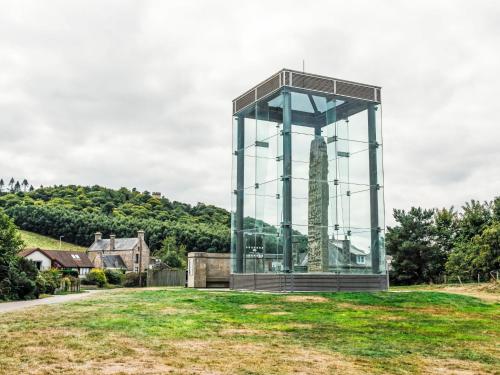 a glass tower on top of a grass field at Apartment Forres View by Interhome in Forres