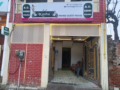 a building with a gate and a parking meter at Kanha Guest House in Varanasi