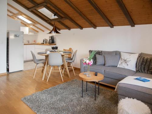 a living room with a couch and a table at Apartment La Siala Apt-70 by Interhome in Falera