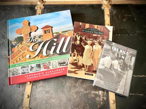 three magazines sitting on top of a table at The Chocolate Suite - Walkable and Peaceful home in Tower Grove