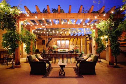 a living room with couches and a table and lights at The Chocolate Suite - Walkable and Peaceful home in Tower Grove