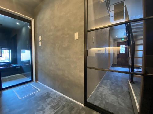an empty room with a glass door and a hallway at HIRARI Mizubenomori - Vacation STAY 08869v in Chikugo