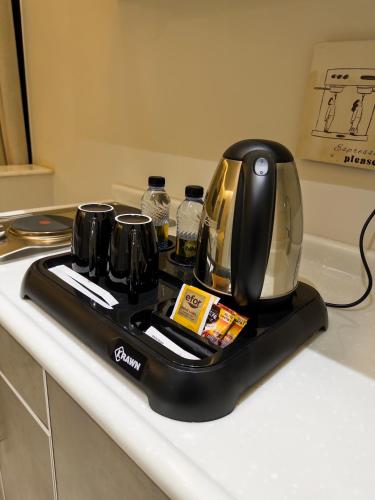a toaster sitting on top of a kitchen counter at AN Studios in Al Khobar