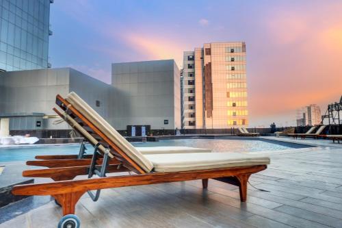 a bench on the roof of a building at Sunday Hotel & Residences Gurugram in Gurgaon