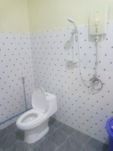 a bathroom with a toilet and a shower at Homestay Srey Mom in Kampot