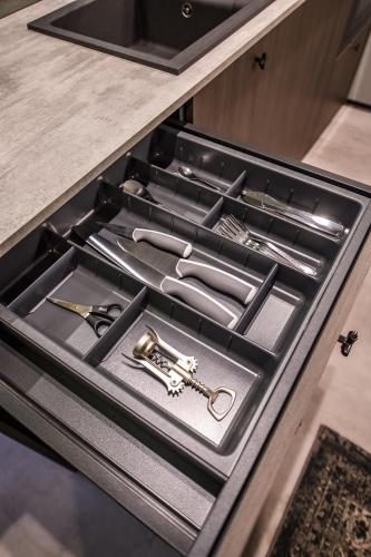 a drawer in a kitchen with a bunch of tools at Jacuzzi Cinema Shibui 5 in Kaunas