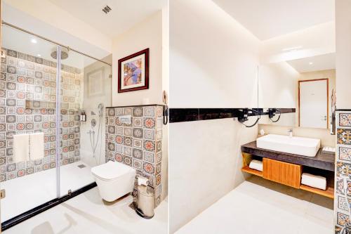a bathroom with a shower and a toilet and a sink at Sunday Resort & Spa Manesar Gurugram in Gurgaon