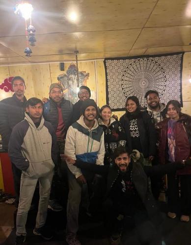 a group of people posing for a picture at IRIS cozy stay and cafe in Tosh