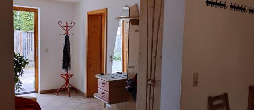 a hallway with a room with a dresser and a window at Familien Zeit in Bad Mitterndorf