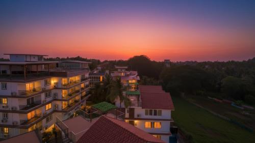 an aerial view of a building at sunset at The Tanisi Hotels and Resorts, Candolim in Candolim