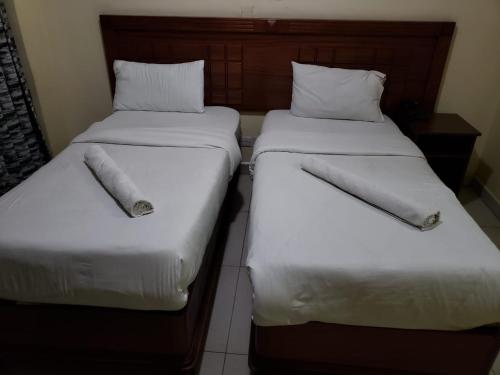 Cama o camas de una habitación en Capital Comfort Hotel