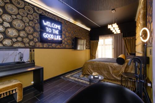 a hotel room with a bed and a welcome to the country sign at Mint Hotel Rosebank in Johannesburg