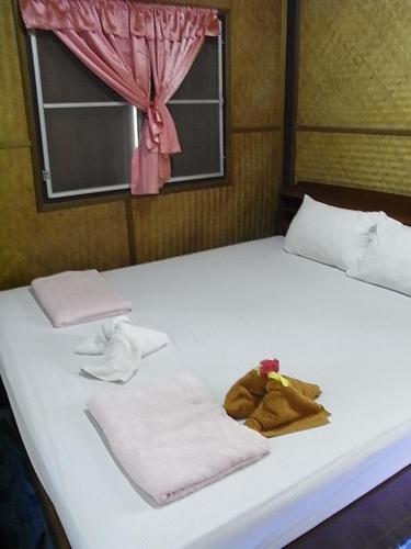 Postel nebo postele na pokoji v ubytování Chokdee Resort